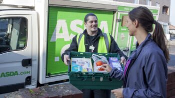 An ASDA employee delivering to a customer.