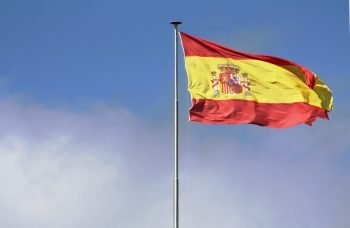 A Spanish flag waving in the wind.