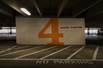 A number 4 on a multi-story carpark wall.